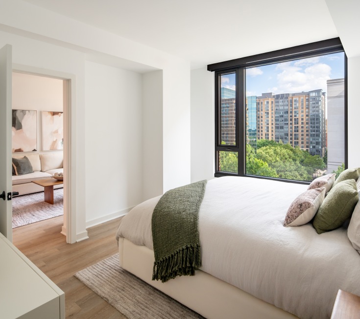a bed in a bright room